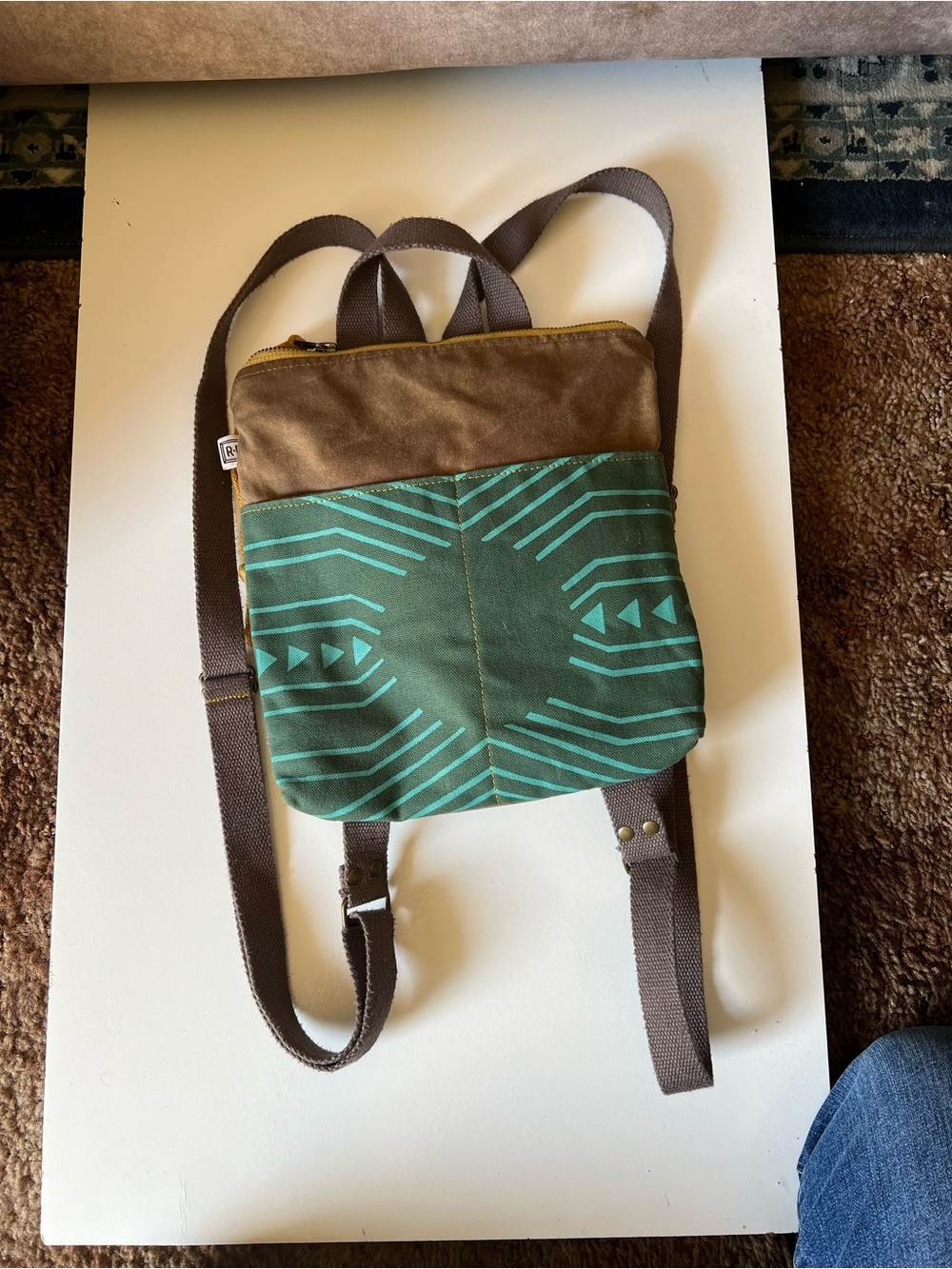 Green Patterned Canvas Crossbody Backpack with Brown Accents